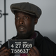Rock Banyon (Michael Kenneth Williams), hauled downtown (Katrina Marcinowski/IFC)